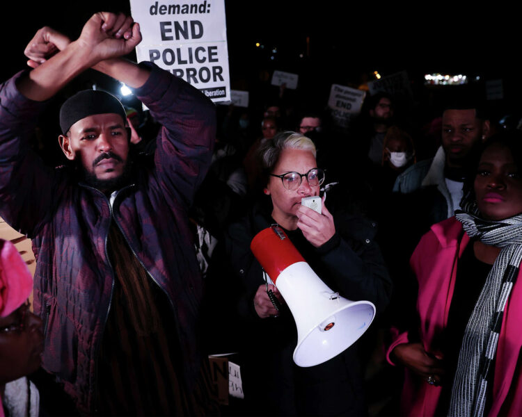 Protesters lead chants of “Hands up, don’t shoot” while blocking traffic on the Interstate 55 bridge in Memphis on Friday during a demonstration over the death of Tyre Nichols